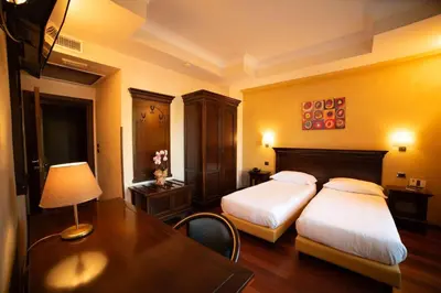 Letto o letti in una camera di Hotel Teocrito