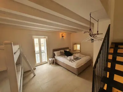 Letto o letti in una camera di Casa Lory