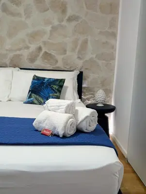 Letto o letti in una camera di Lues Rooms