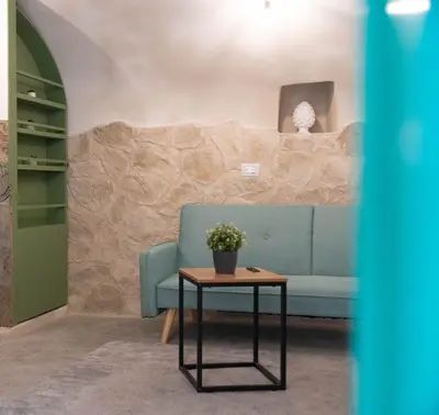 Area soggiorno di Lues Rooms