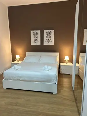 Letto o letti in una camera di Sicilia nel Cuore Apartment