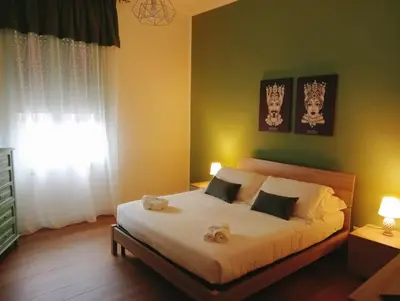 Letto o letti in una camera di Sicilia nel Cuore Apartment