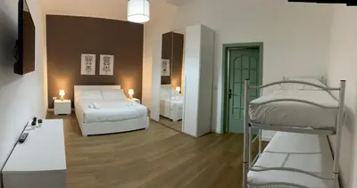 Letto o letti in una camera di Sicilia nel Cuore Apartment