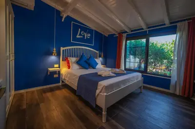 Letto o letti in una camera di B&B Le Saline