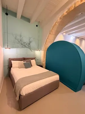 Letto o letti in una camera di Insula - Apartments & Comfort in Ortigia