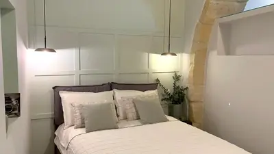 Letto o letti in una camera di Insula - Apartments & Comfort in Ortigia