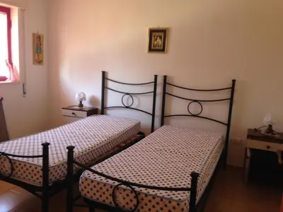 Letto o letti in una camera di Appartamento con veranda primo piano