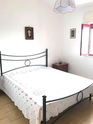 Letto o letti in una camera di Appartamento con veranda primo piano