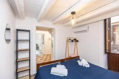 Letto o letti in una camera di Casa Charlotte by Ortigia Apartments