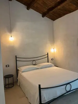 Letto o letti in una camera di Casa Ellera