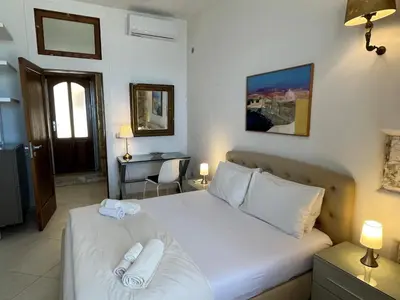 Letto o letti in una camera di Casa Calarossa Ortigia