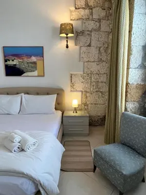 Letto o letti in una camera di Casa Calarossa Ortigia