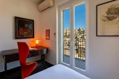 Letto o letti in una camera di Casa Aurora