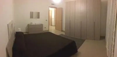 Letto o letti in una camera di casa Carlotta