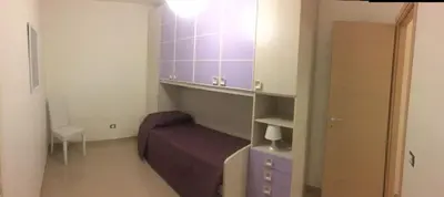 Letto o letti in una camera di casa Carlotta