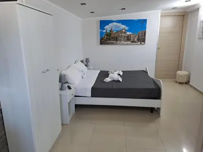 Letto o letti in una camera di Il Quadrifoglio House Airport
