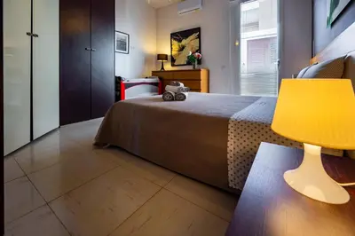 Letto o letti in una camera di Appartamento in villa-giardino-50 m dal mare