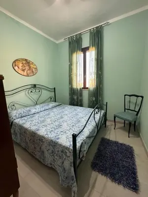 Letto o letti in una camera di Villa Azzurra