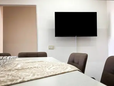 TV o dispositivi per l'intrattenimento presso Caruso Etna View Apartment