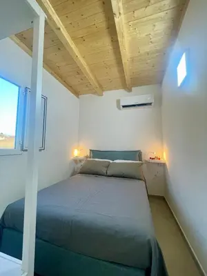 Letto o letti in una camera di Anastasia Beach Cottage GIRASOLE