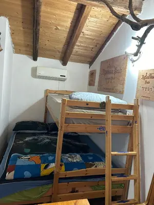 Letto o letti in una camera di Mansarda IGUANA