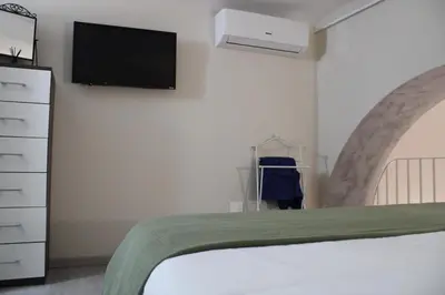 Letto o letti in una camera di Residenza Marconi vicino Ortigia