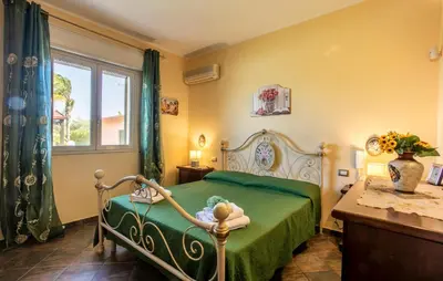 Letto o letti in una camera di Villa Sally