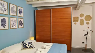 Letto o letti in una camera di L'isola di Calipso, accogliente appartamento vicino Ortigia & Wi Fi