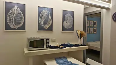 TV o dispositivi per l'intrattenimento presso L'isola di Calipso, accogliente appartamento vicino Ortigia & Wi Fi
