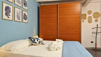 Letto o letti in una camera di L'isola di Calipso, accogliente appartamento vicino Ortigia & Wi Fi