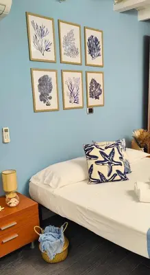Letto o letti in una camera di L'isola di Calipso, accogliente appartamento vicino Ortigia & Wi Fi