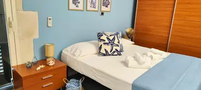 Letto o letti in una camera di L'isola di Calipso, accogliente appartamento vicino Ortigia & Wi Fi