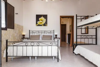 Letto o letti in una camera di Giardino del Teatro, casa vacanze immersa nel verde