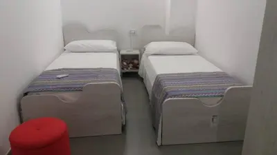 Letto o letti in una camera di Two-story house in the city -climatized - wifi