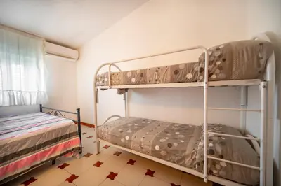 Letto o letti in una camera di Mare Blu Apartment - Sicilia Vacanza