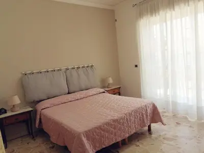 Letto o letti in una camera di VITTORIA APARTMENT 4 posti letto parcheggio libero