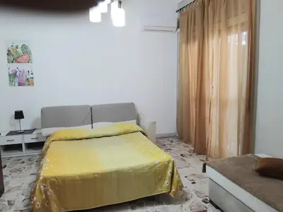 Letto o letti in una camera di VITTORIA APARTMENT 4 posti letto parcheggio libero