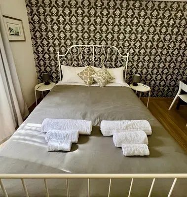 Letto o letti in una camera di Casa Vittorio