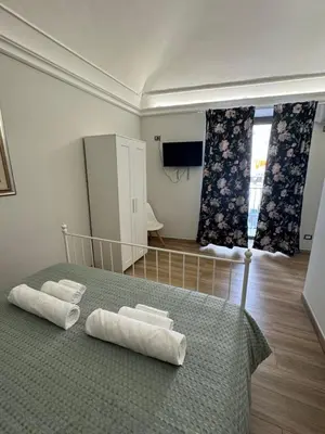 Letto o letti in una camera di Casa Vittorio