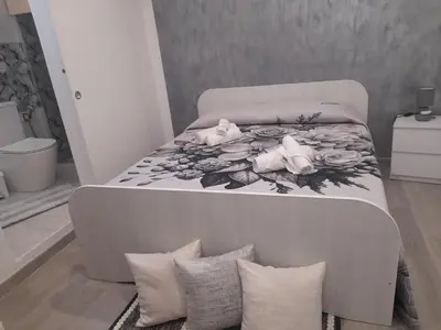 Letto o letti in una camera di b&b in villa Porto fossa