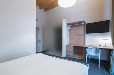 Letto o letti in una camera di La Dimora di San Nicola Ortigia Boutique Apartments - Terrace & Jacuzzi Access