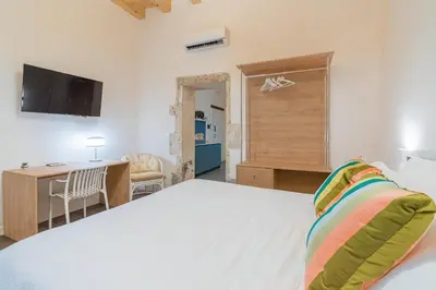 Letto o letti in una camera di La Dimora di San Nicola Ortigia Boutique Apartments - Terrace & Jacuzzi Access