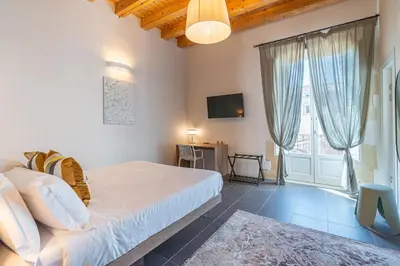Letto o letti in una camera di La Dimora di San Nicola Ortigia Boutique Apartments - Terrace & Jacuzzi Access