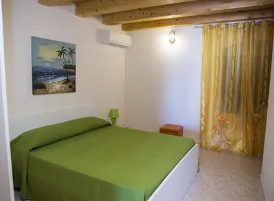 Letto o letti in una camera di Casa Vacanze Calafarina