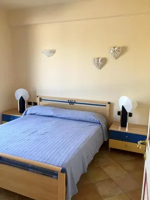 Letto o letti in una camera di Villa tra gli ulivi