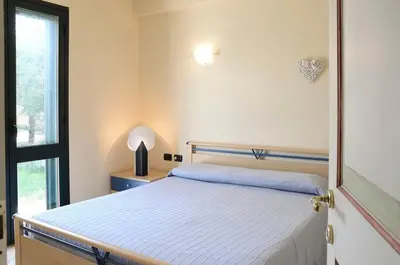 Letto o letti in una camera di Villa tra gli ulivi