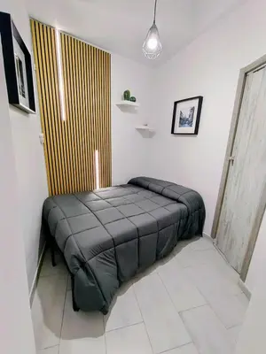 Letto o letti in una camera di Lucky Home