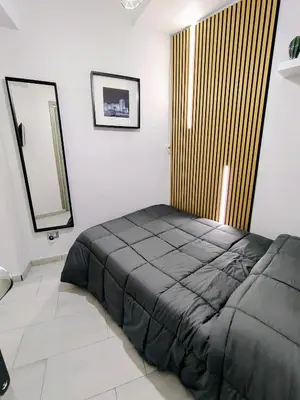 Letto o letti in una camera di Lucky Home