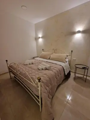 Letto o letti in una camera di House in the castle VIA GRAMIGNANI N 35 CATANIA