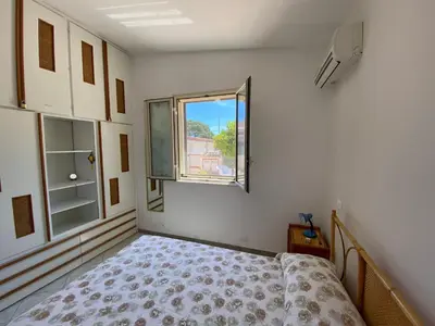 Letto o letti in una camera di Villa Amos Marzamemi San Lorenzo